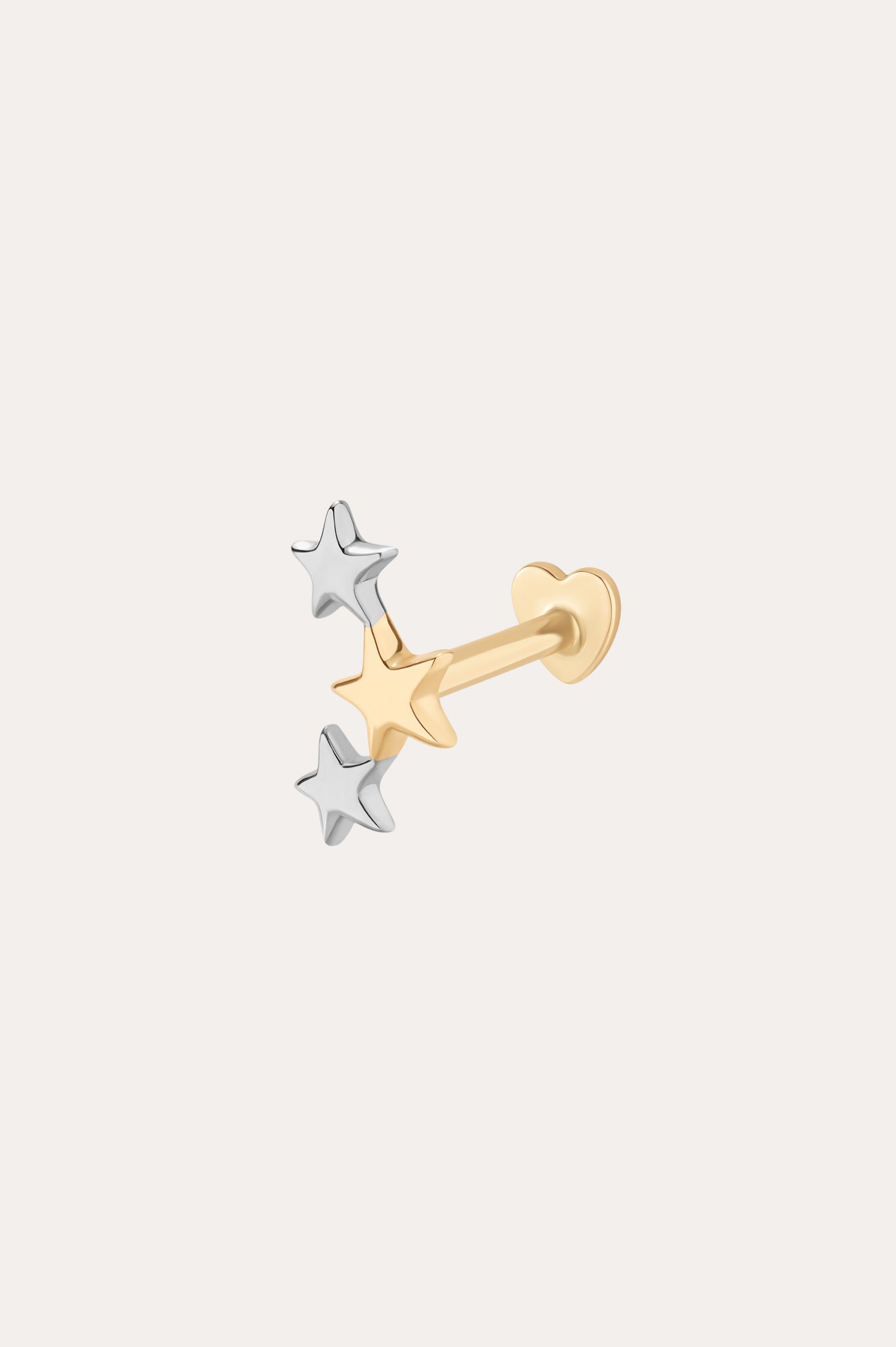 The 14K Solid Mixed Gold Star Cluster Flat Back Stud features three small stars—one gold, two silver—arranged in a cluster at the front. Its heart-shaped backing contrasts against a plain, light background. Color: Mixed Gold.