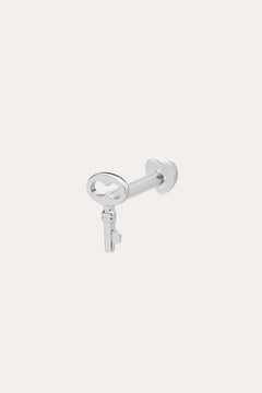 The 14K Solid White Gold Key Flat Back Stud, crafted in 14K white gold, is shown against a light background—ideal as a chic cartilage earring.