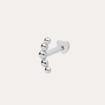 The 14K Solid White Gold Curved Ball Flat Back Stud features six shiny round beads in a curved line, shown on a plain white background—an elegant choice for body jewellery.