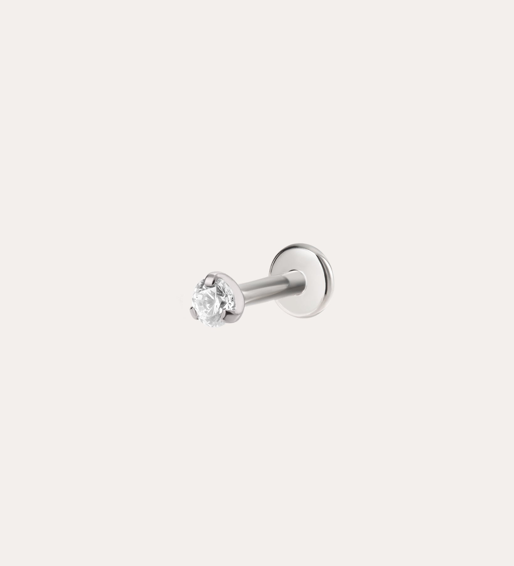 A 2.5mm Martini Set Threadless Flat Back Titanium Cartilage Stud in Platinum, featuring a small round clear gemstone in a platinum PVD finish, displayed on a plain white background.