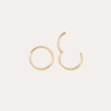 Two 14K Solid Yellow Gold 20G Mini Clicker hoop earrings are shown on a plain white background; one earring is fully closed and the other is partially open.