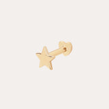 The 14K Solid Yellow Gold Star Flat Back Stud features a five-pointed star design in gleaming 14K yellow gold, making it a striking celestial ear accessory against any plain, light background.
