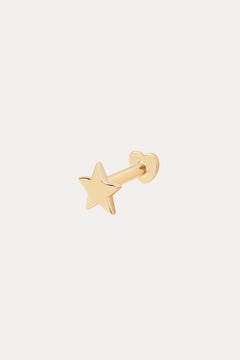 The 14K Solid Yellow Gold Star Flat Back Stud features a five-pointed star design in gleaming 14K yellow gold, making it a striking celestial ear accessory against any plain, light background.
