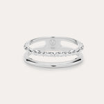 The Molten Double Band Ring in Sterling Silver features two parallel bands—one smooth, one twisted rope—connected at the sides. Stamped 925 and with a geometric logo, it's perfect for everyday wear on a light background.