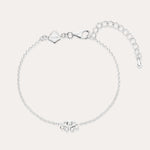 The Defender Evil Eye Bracelet in Sterling Silver features a central charm with clear cubic zirconia, an adjustable extension chain, lobster clasp, and a small square tag near the clasp.