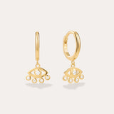 Defender Evil Eye Hoops in 18k Gold Plated, featuring dangling evil eye charms with a central clear stone and four smaller stones on the bottom edge, showcased as unique spiritual jewelry against a plain light background.