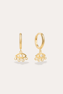 Defender Evil Eye Hoops in 18k Gold Plated, featuring dangling evil eye charms with a central clear stone and four smaller stones on the bottom edge, showcased as unique spiritual jewelry against a plain light background.
