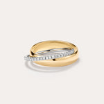 The Mixed Metal Interlocking Ring, featuring a 14K gold plated band intertwined with a slender silver band adorned with small diamonds and sparkling cubic zirconia, creates a modern, stylish statement against a plain light background.
