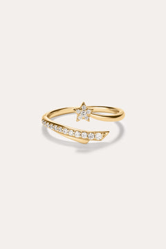 The Crystal Shooting Star Open Ring in Gold features a star-shaped design adorned with small white gemstones on both the band and the star, crafted in 14K gold plated finish. Set against a plain light background, this adjustable ring offers a comfortable fit.