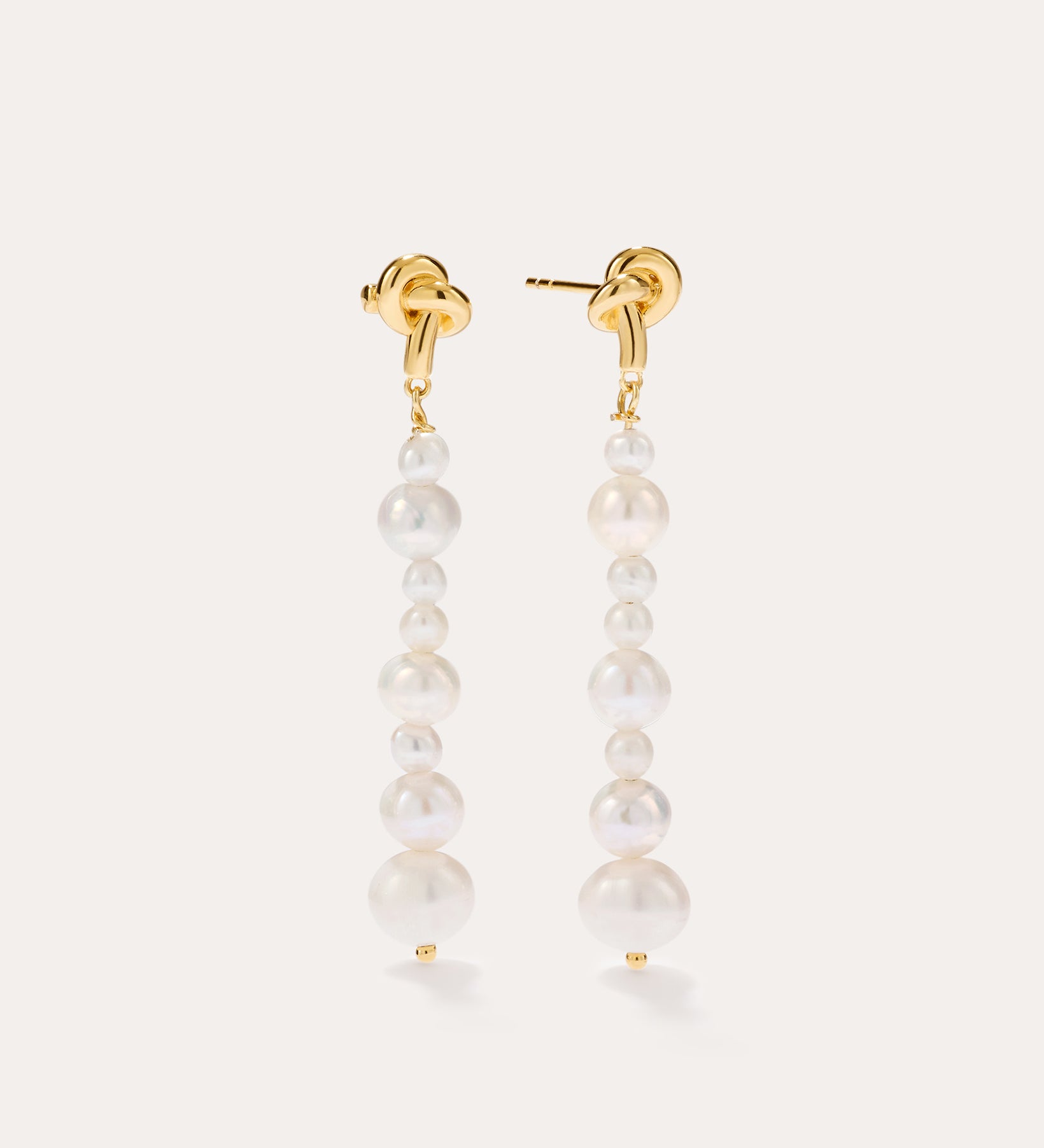 Knot Multi Pearl Drop Earrings in 14K Gold Plated, featuring a vertical row of graduated freshwater pearls, displayed against a plain light background.