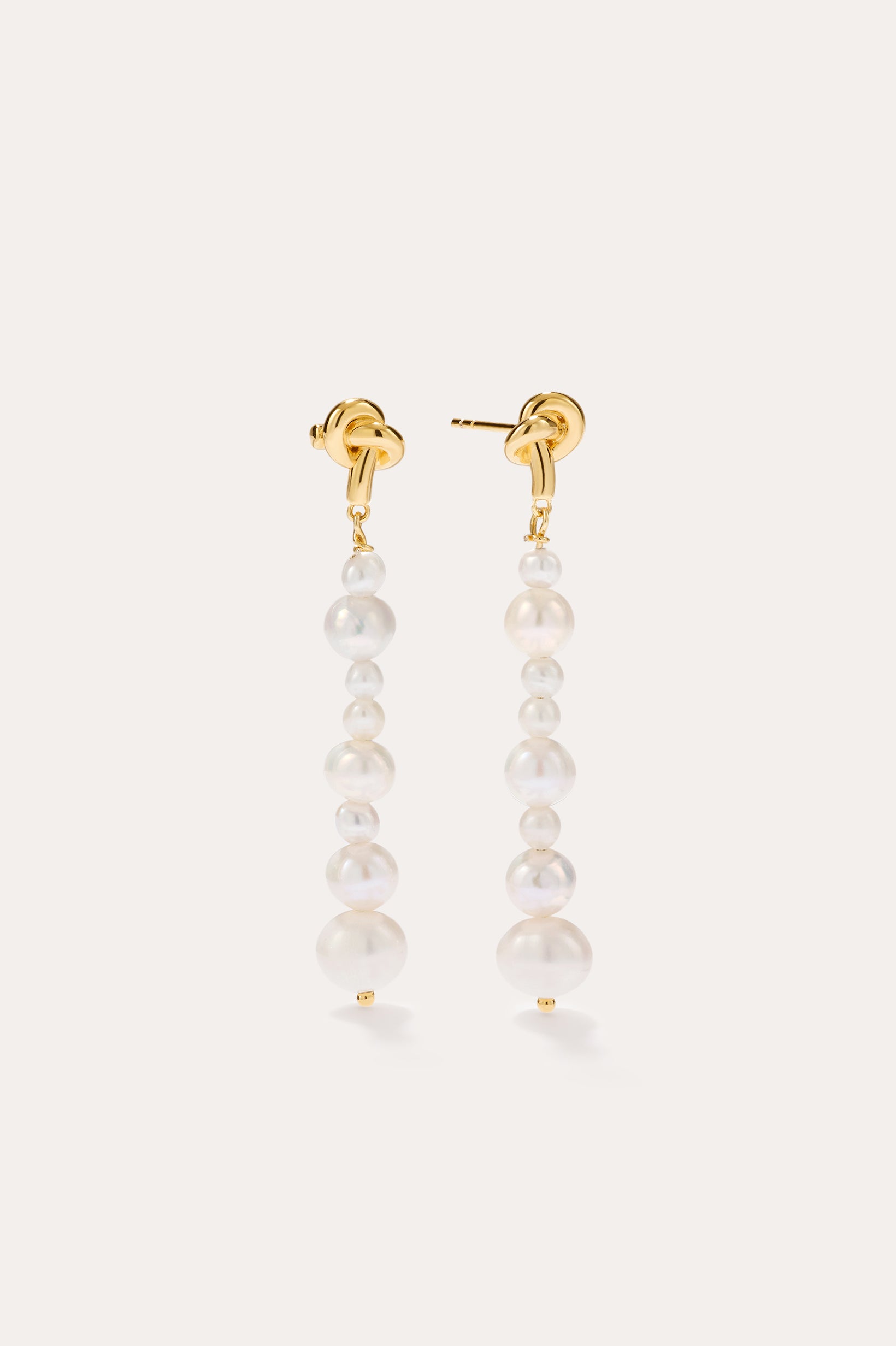 Knot Multi Pearl Drop Earrings in 14K Gold Plated, featuring a vertical row of graduated freshwater pearls, displayed against a plain light background.