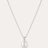 Introducing the Freshwater Pearl Necklace in Silver—a striking jewelry piece showcasing a single round white pearl pendant, elegantly suspended from a sterling silver adjustable slider chain and set against a plain light background.