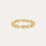 The Noa Link Ring in Gold features 14K gold plating and delicate knot details, with a 925 stamp on the inside. Set against a plain light background, it’s perfect for stacking and elevating your everyday style.
