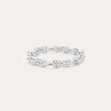 Introducing the Noa Link Ring in Silver: a thin sterling silver band featuring a series of chain-inspired, knot-like links evenly spaced around its circumference. Shown against a plain, light background, this elegant piece is the perfect stacking ring for any collection.