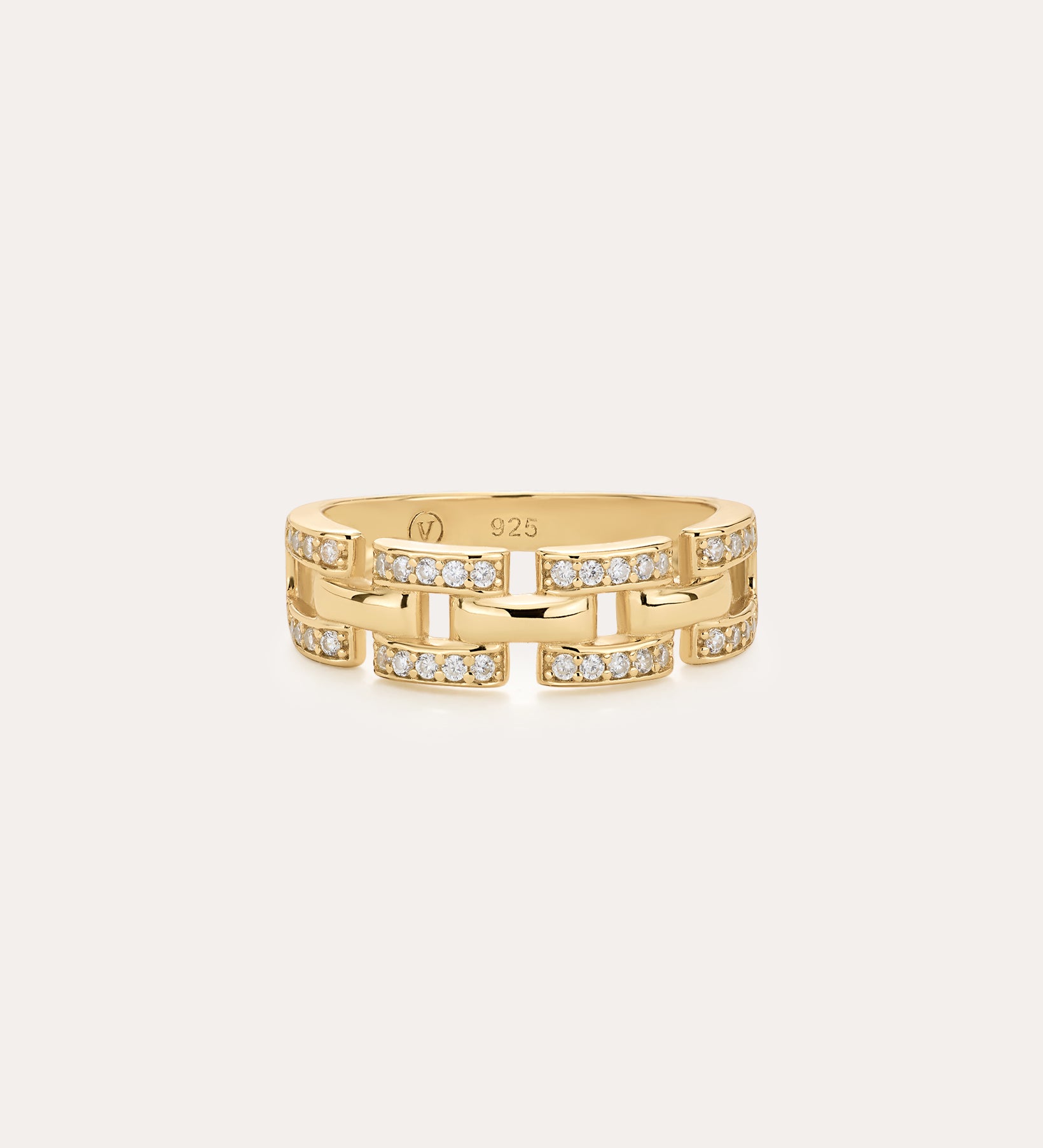 The Crystal Link Ring in Gold features a 14K gold plated, geometric chain link design with small embedded clear stones, and is displayed on a plain light background.