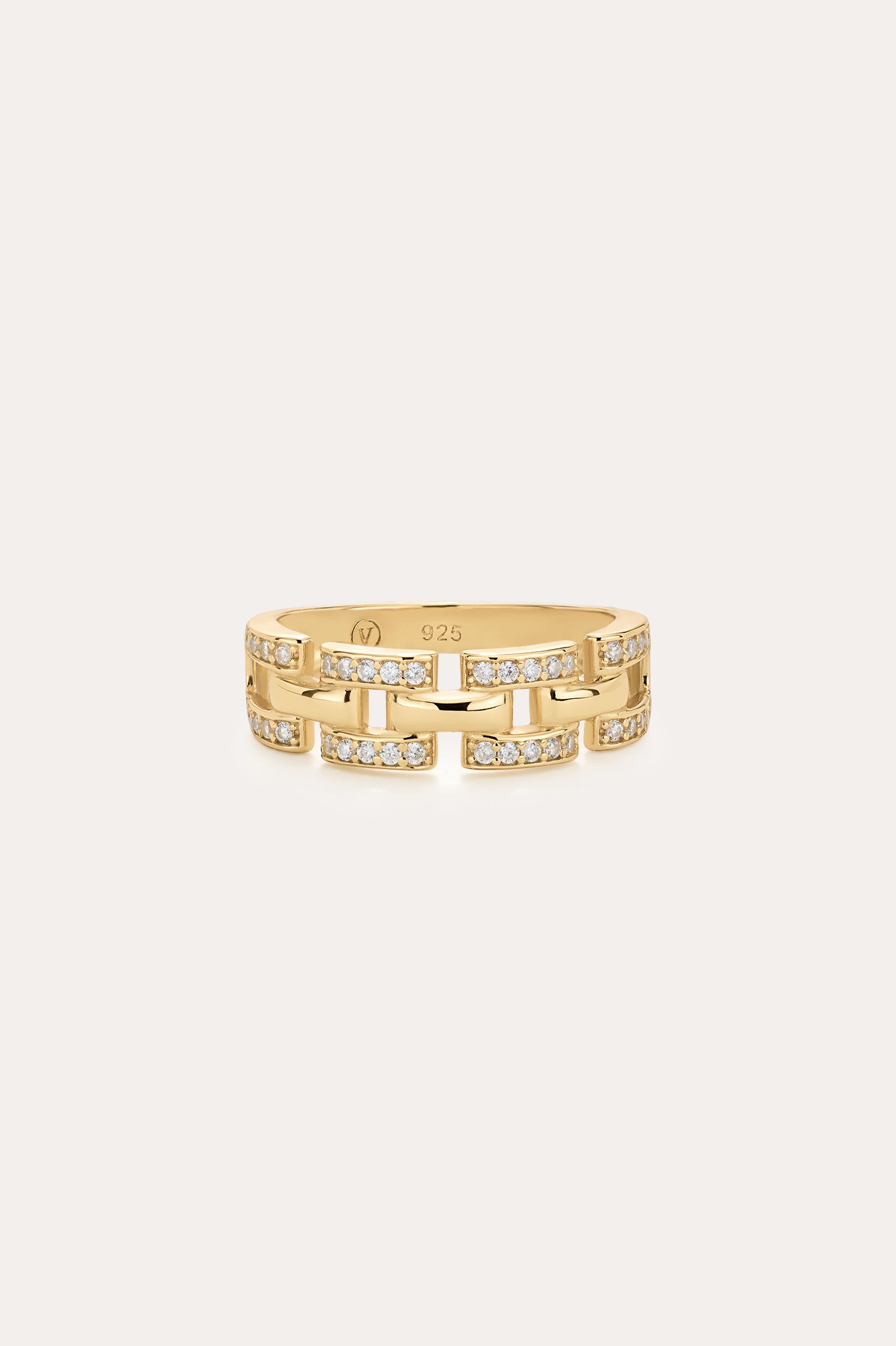 The Crystal Link Ring in Gold features a 14K gold plated, geometric chain link design with small embedded clear stones, and is displayed on a plain light background.