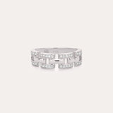 The Crystal Link Ring in Sterling Silver showcases a geometric, open link design adorned with clear cubic zirconia gemstones on each segment, presented against a minimalistic light background.