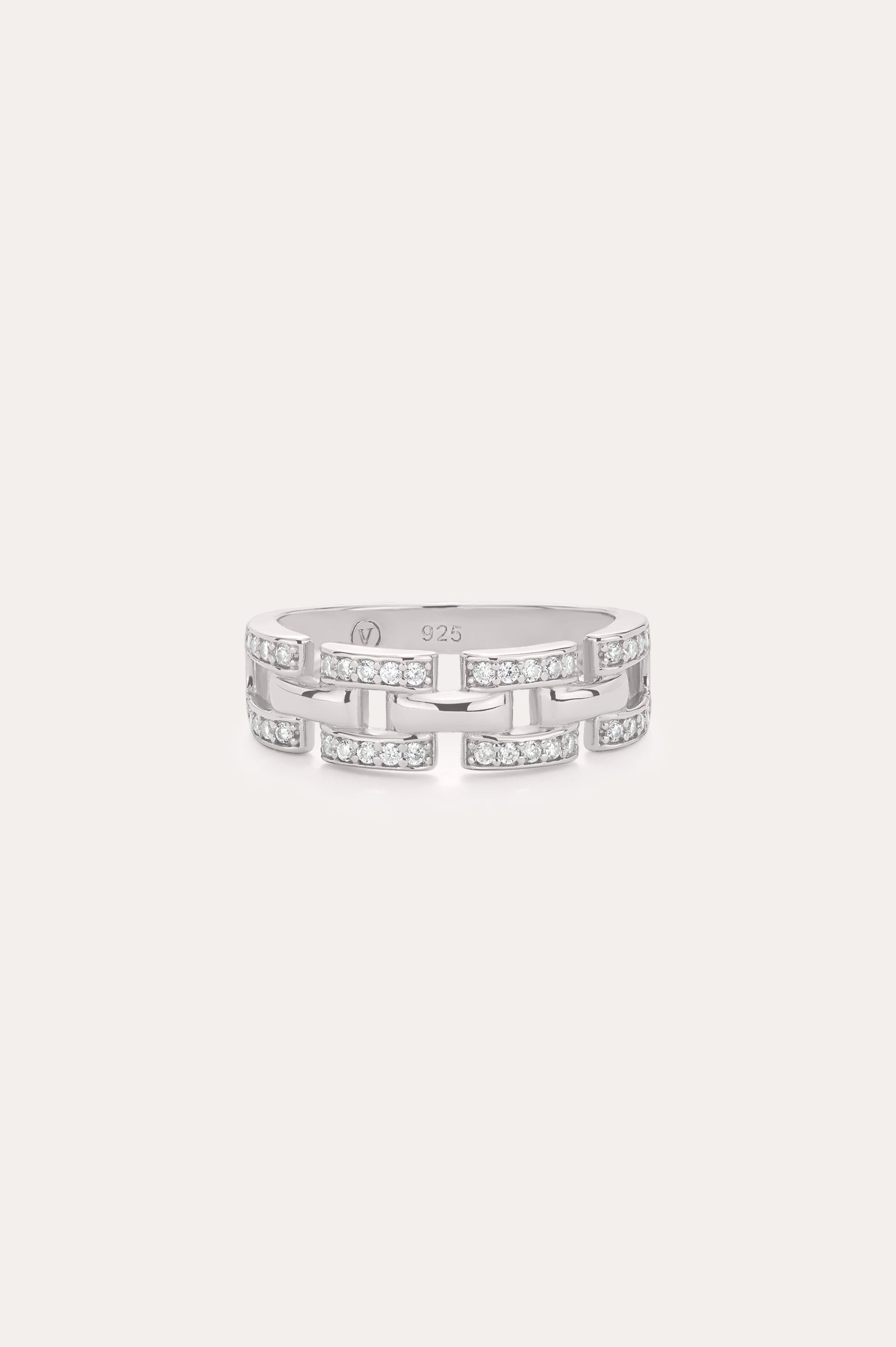 The Crystal Link Ring in Sterling Silver showcases a geometric, open link design adorned with clear cubic zirconia gemstones on each segment, presented against a minimalistic light background.