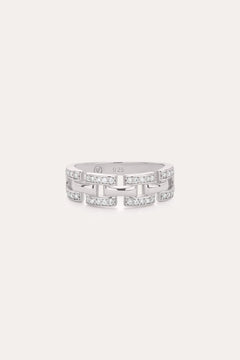 The Crystal Link Ring in Sterling Silver showcases a geometric, open link design adorned with clear cubic zirconia gemstones on each segment, presented against a minimalistic light background.
