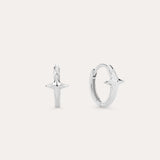 A pair of 14K Recycled Solid White Gold Star Huggie Earrings, each with a four-pointed star charm, shown against a plain light background.