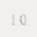 The Mother of Pearl Huggies in Sterling Silver are shown against a white background, with one earring front-facing and the other from the side—lightweight hoops ideal for daily wear or stacking with your favourite jewellery.