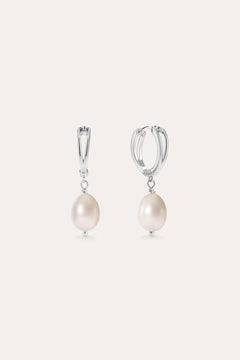 A pair of Freshwater Pearl Charm Hoops in Sterling Silver, each adorned with a single round white freshwater pearl suspended from the bottom, displayed on a plain light background.