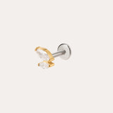 Introducing the Double Marquise Threadless Flat Back Titanium Cartilage Stud in Gold—crafted in sleek titanium with a luxurious yellow gold PVD finish, this refined piece showcases two clear marquise-cut gems in gold prongs atop a silver post. Designed as a flat back earring, it offers superior comfort and durability, making it the perfect choice for those seeking an elegant cartilage accessory.