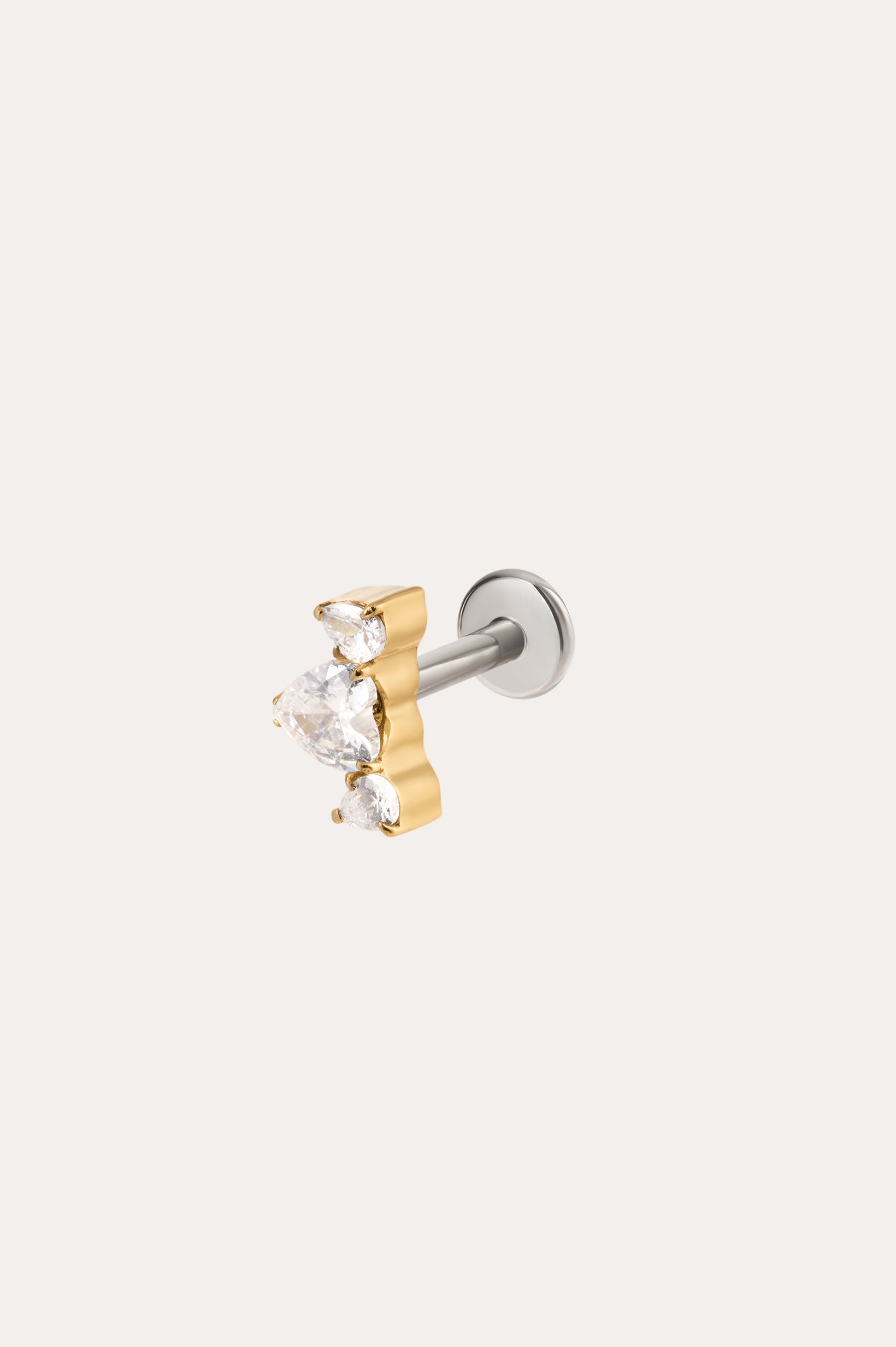 A Curved Crystal Threadless Flat Back Titanium Cartilage Stud in Yellow Gold PVD, featuring a central teardrop-shaped clear gemstone flanked by two smaller pear-shaped clear crystals, displayed on a plain light background.
