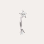 A curved implant-grade titanium barbell earring in a platinum PVD finish, featuring a small clear gemstone at one end and a star-shaped design with sparkling clear stones at the other, set against a plain light background. This hypoallergenic Crystal Star Titanium Rook Barbell in Platinum offers elegant sparkle and comfortable wear for sensitive ears.