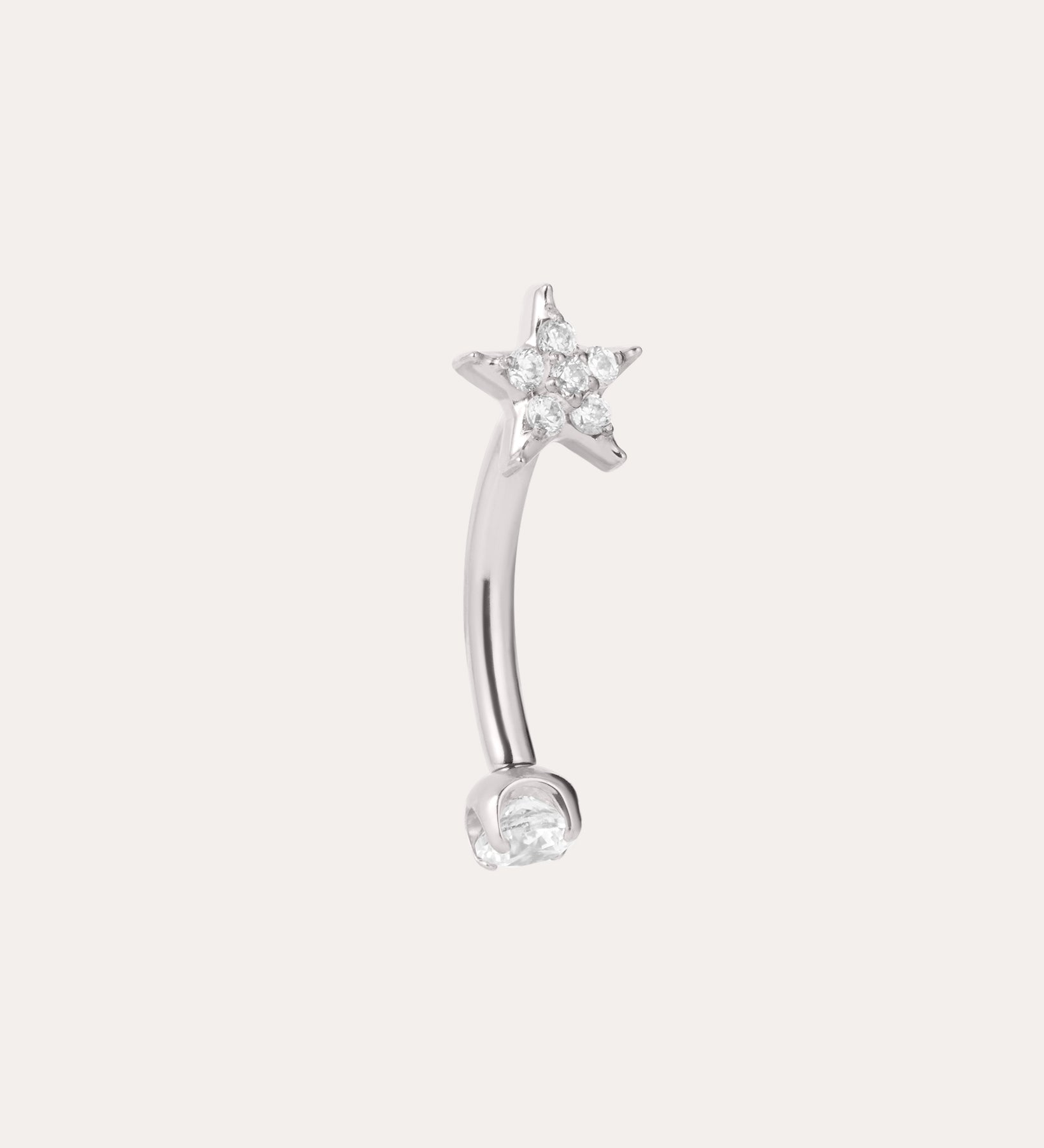 A curved implant-grade titanium barbell earring in a platinum PVD finish, featuring a small clear gemstone at one end and a star-shaped design with sparkling clear stones at the other, set against a plain light background. This hypoallergenic Crystal Star Titanium Rook Barbell in Platinum offers elegant sparkle and comfortable wear for sensitive ears.