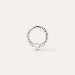 A Crystal Heart Titanium Daith Ring in Platinum, featuring a central heart-shaped gemstone flanked by two smaller round gemstones on each side, displayed on a plain light background. Crafted from implant-grade titanium with a platinum PVD finish, this hypoallergenic daith ring combines elegance with comfort for everyday wear.