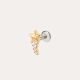 Introducing the Crystal Shooting Star Threadless Flat Back Titanium Cartilage Stud in Yellow Gold PVD—a sleek gold star earring featuring five small clear gemstones arranged in a graceful, descending curve. This dazzling piece is attached to a silver post and showcased on a simple light background, evoking the brilliance of a crystal shooting star.