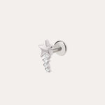 The Crystal Shooting Star Threadless Flat Back Titanium Cartilage Stud in Platinum features a star-shaped stud with three small, round, clear gemstones dangling below it. Shown against a plain white background, this platinum PVD earring offers both style and comfort with its threadless flat back design for your piercing.