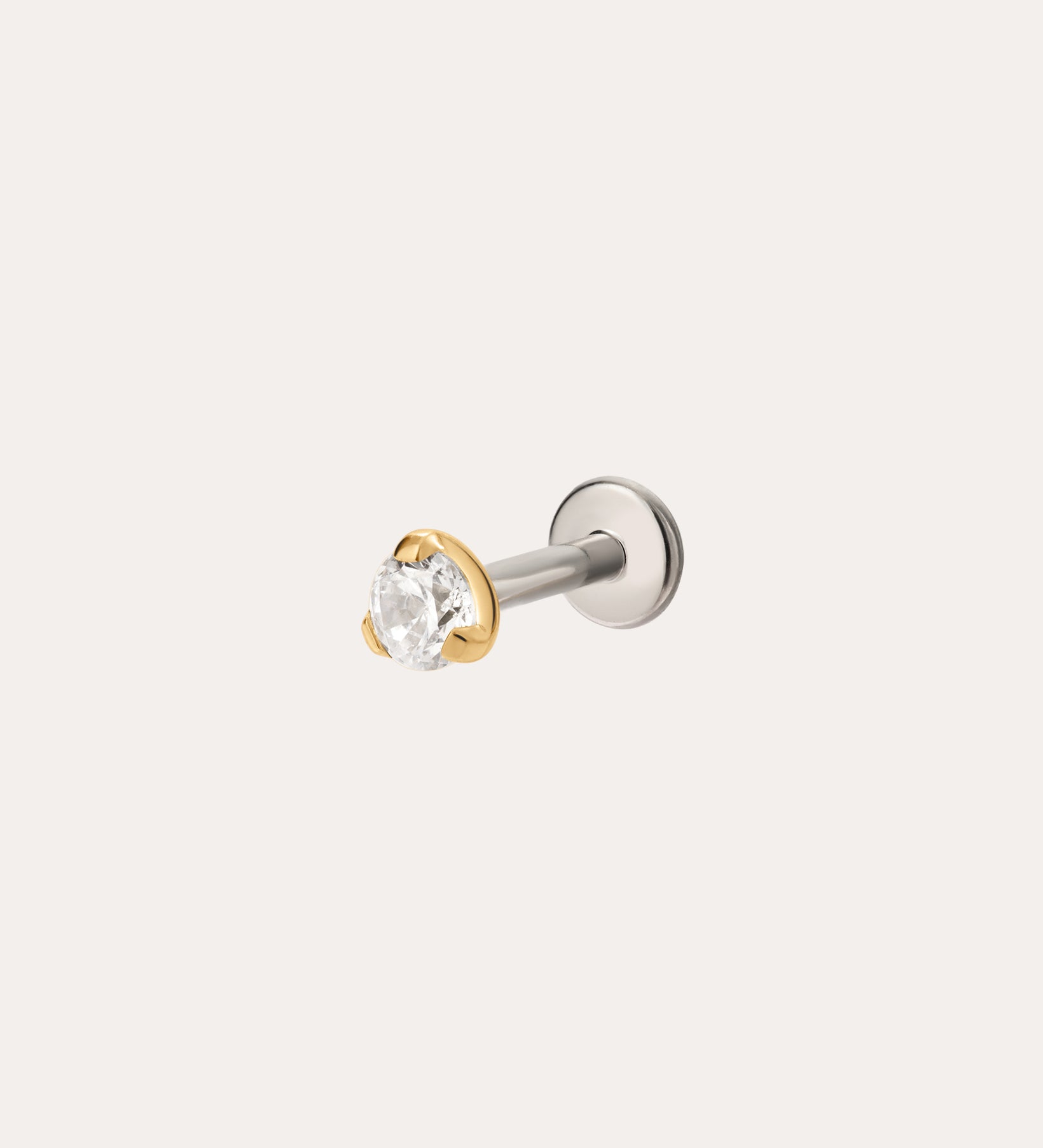 A 3mm Martini Set Threadless Flat Back Titanium Cartilage Stud in Yellow Gold PVD, featuring a round clear gemstone in a gold bezel on a straight silver post, displayed against a plain light background.