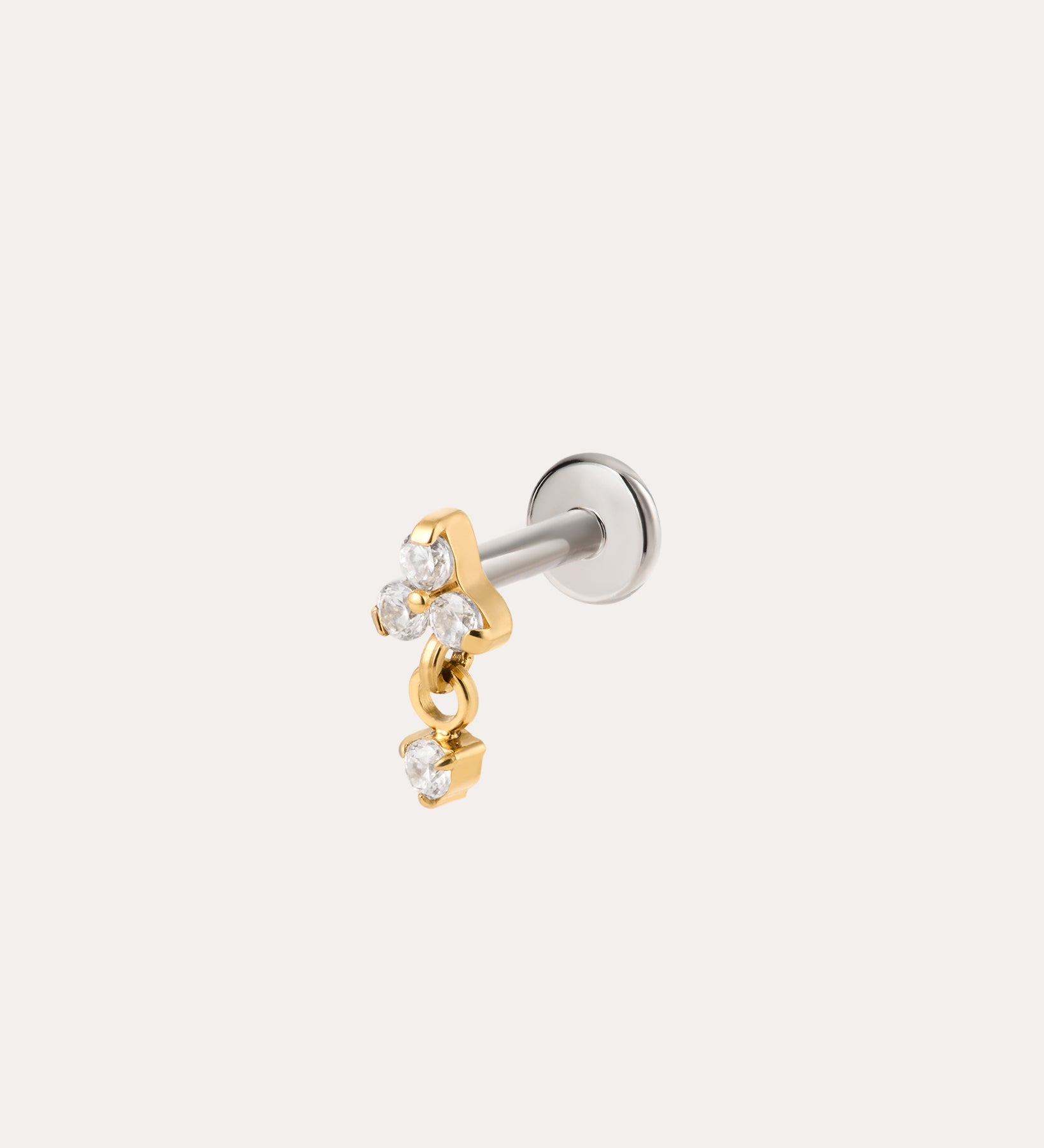 The Crystal Dangle Threadless Flat Back Titanium Cartilage Stud in Gold, shown in yellow gold PVD, features a sleek barbell design with a gold star charm and three small clear gemstones. A dangling cluster of gold and crystals adds sparkle, while the threadless flat back ensures comfortable wear. The earring is photographed against a plain white background, highlighting its elegant crystal dangle style.