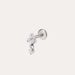 The Crystal Dangle Threadless Flat Back Titanium Cartilage Stud in Platinum features three small, clear gemstones arranged in a delicate cluster on a platinum PVD finish—an elegant example of hypoallergenic piercing jewelry designed for everyday comfort.