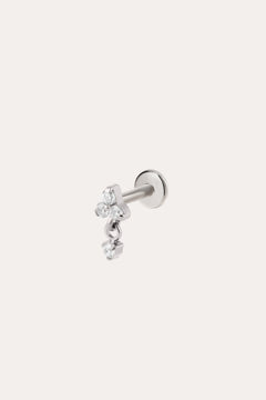 The Crystal Dangle Threadless Flat Back Titanium Cartilage Stud in Platinum features three small, clear gemstones arranged in a delicate cluster on a platinum PVD finish—an elegant example of hypoallergenic piercing jewelry designed for everyday comfort.