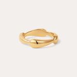 The Colette Link Droop Ring in 18k Gold Plated features a smooth, organic design with gentle curves; displayed on a simple, light background, it’s a refined statement ring for any occasion.