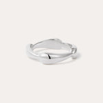 The Colette Link Droop Ring in Silver features a minimalist design with a smooth, slightly irregular band and rounded ends, shown against a light background.