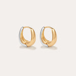 The Gia Reversible 2 Tone Chubby Hoop Earrings feature a smooth, rounded design in 18k gold and sterling silver, shown against a plain light background.