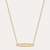 The Viva La Vida Bar Chain Necklace in Gold features an oval horizontal pendant engraved with VIVA LA VIDA on an adjustable delicate figaro chain for the perfect fit.