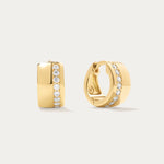 The Juni Pavé Chunky Hoop Earrings in Gold are 18k gold-plated hoops, each accented with a central vertical row of sparkling pavé diamonds, shown against a simple light background.