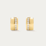 The Juni Pavé Chunky Hoop Earrings in Gold feature a modern rectangular shape, 18k gold plating, and a vertical row of sparkling CZ crystals on each polished huggie hoop.