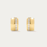 The Juni Pavé Chunky Hoop Earrings in Gold feature a modern rectangular shape, 18k gold plating, and a vertical row of sparkling CZ crystals on each polished huggie hoop.