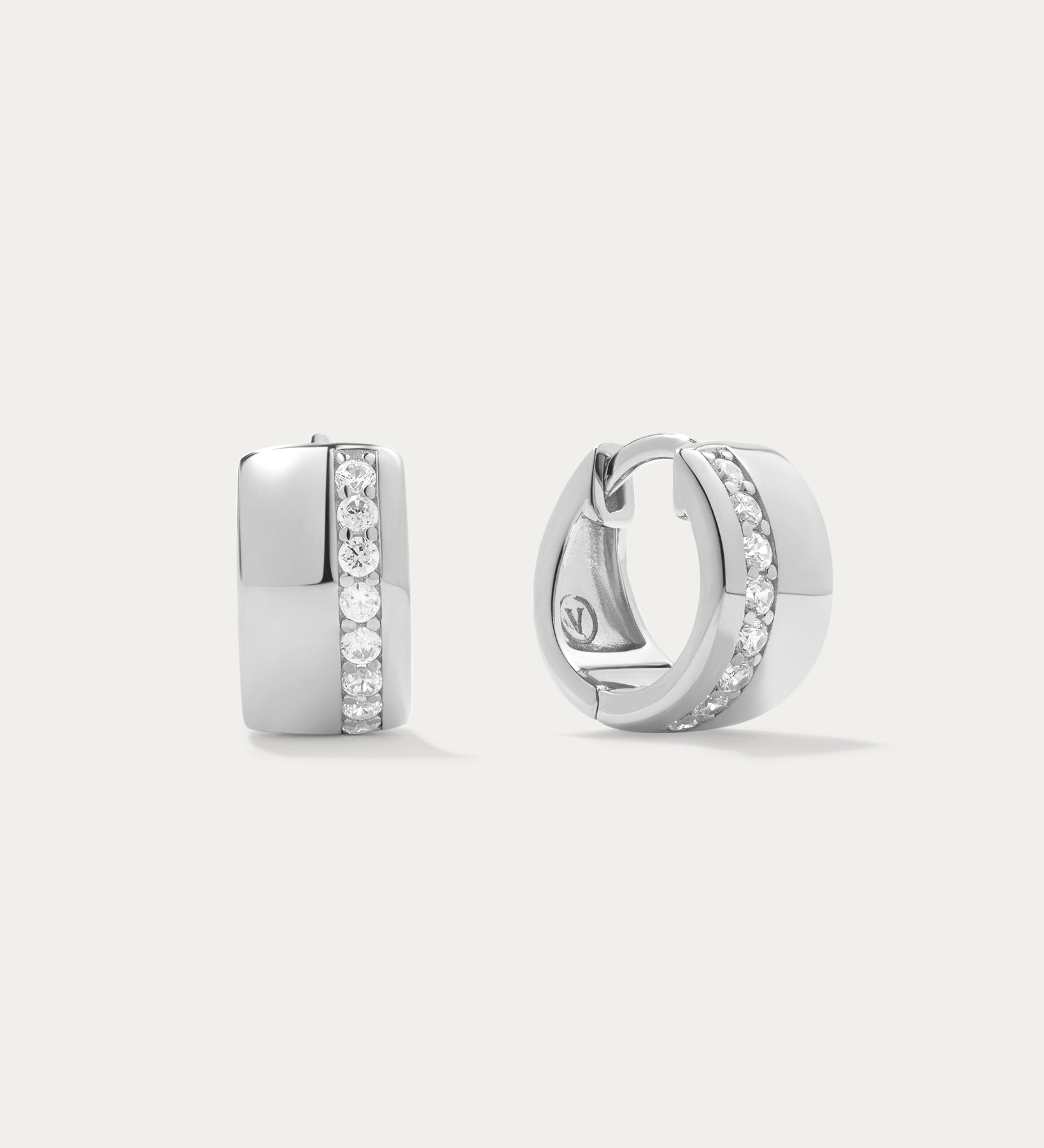 Juni Pavé Chunky Hoop Earrings in Silver: Sterling silver hoops with a vertical row of sparkling diamonds, shown against a plain white background.