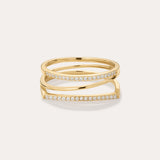 The Nola Pavé Triple Band Ring in Gold features a modern, stacked design with three gold bands, each pavé-set with sparkling diamonds, displayed against a plain light background.