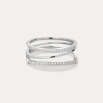 The Nola Pavé Triple Band Ring in Silver features three thin, parallel pavé bands set with sparkling white stones, connected at the sides and displayed on a plain light background.