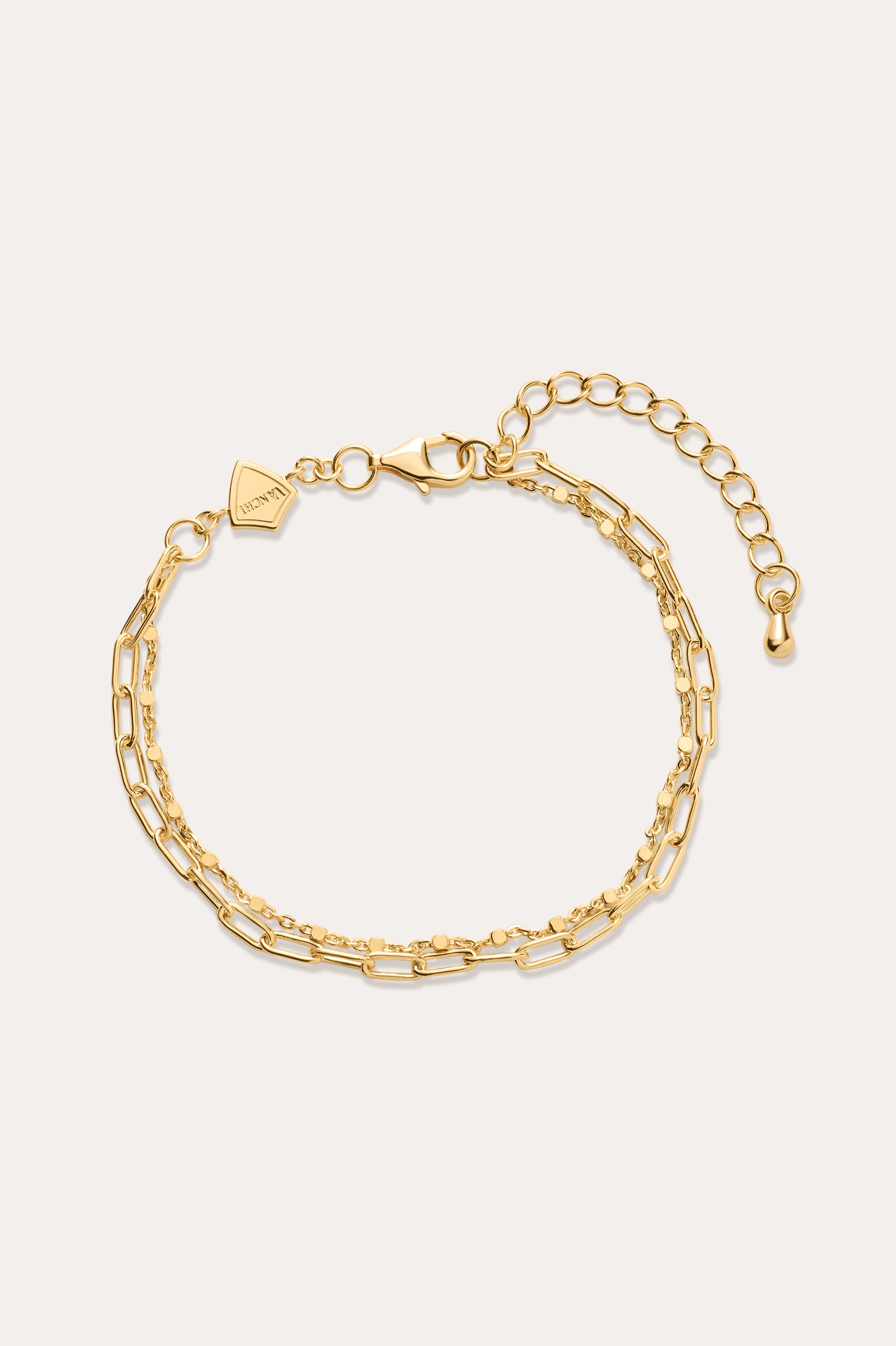 Gold chain bracelet on a white background