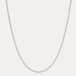 The Alba Tennis Necklace in Silver is displayed against a plain white background, highlighting its delicate and understated elegance.