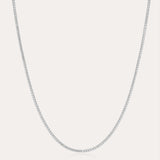 The Alba Tennis Necklace in Silver is displayed against a plain white background, highlighting its delicate and understated elegance.
